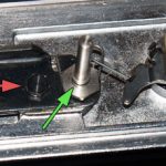remove small bolt, mirror post & lossen cam screw